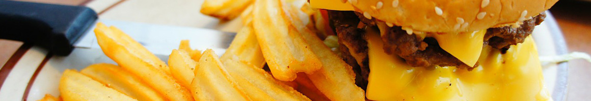 Eating American (Traditional) Burger Hot Dog at Abbott Texas Red Hots restaurant in Buffalo, NY.